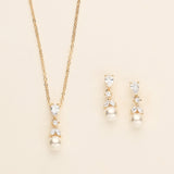 a necklace and earring set with pearls