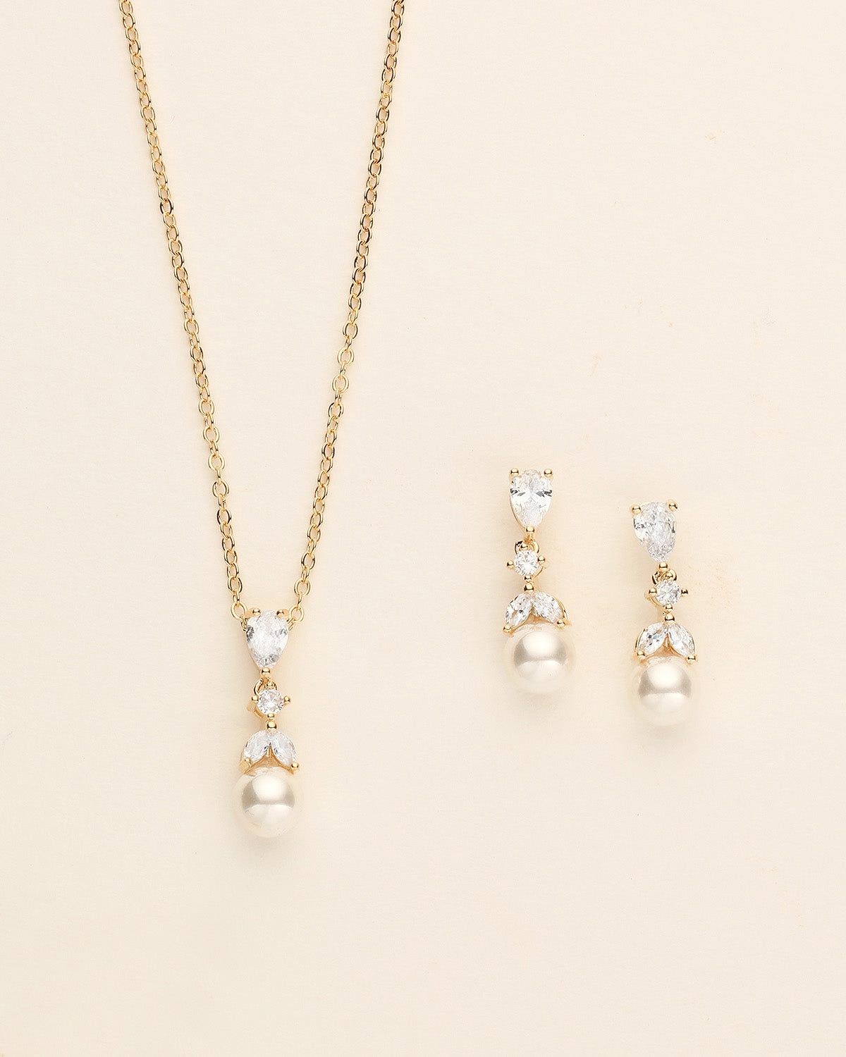 a necklace and earring set with pearls