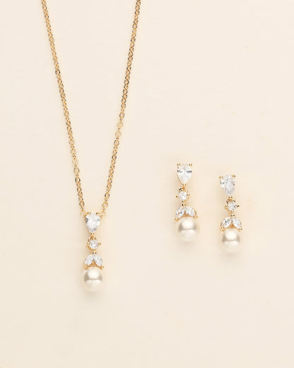 a necklace and earring set with pearls