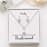 A necklace and earring set presented in a white box, with a personalized message on the box.