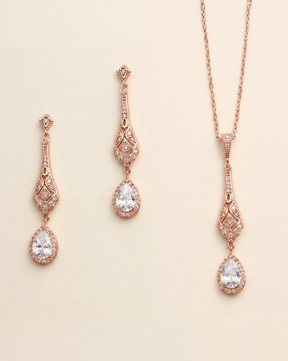 a set of elegant jewelry pieces, including earrings and a necklace, all featuring intricate designs and sparkling gemstones.