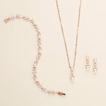 a necklace and earring set with pearls