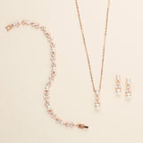 a necklace and earring set with pearls