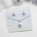 a bridesmaid necklace and earring set with pearls
