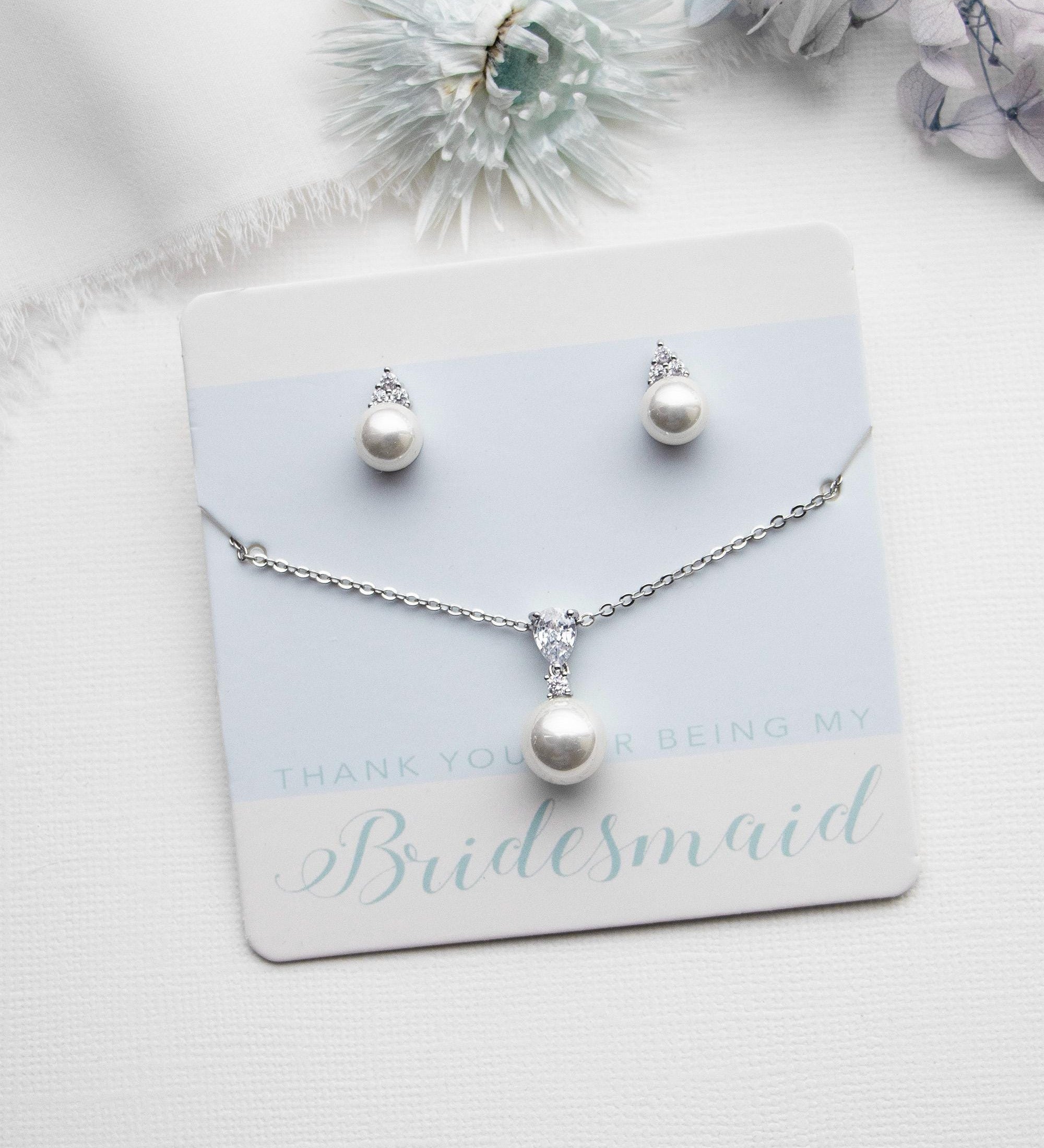 a bridesmaid necklace and earring set with pearls