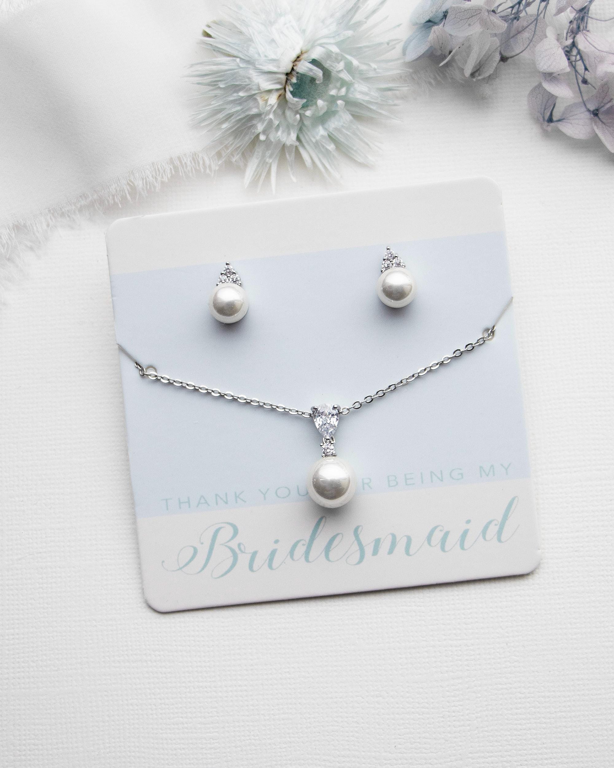 a bridesmaid necklace and earring set with pearls