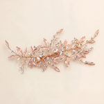 A decorative hair accessory with a floral design and sparkling crystal elements.