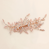 A decorative hair accessory with a floral design and sparkling crystal elements.