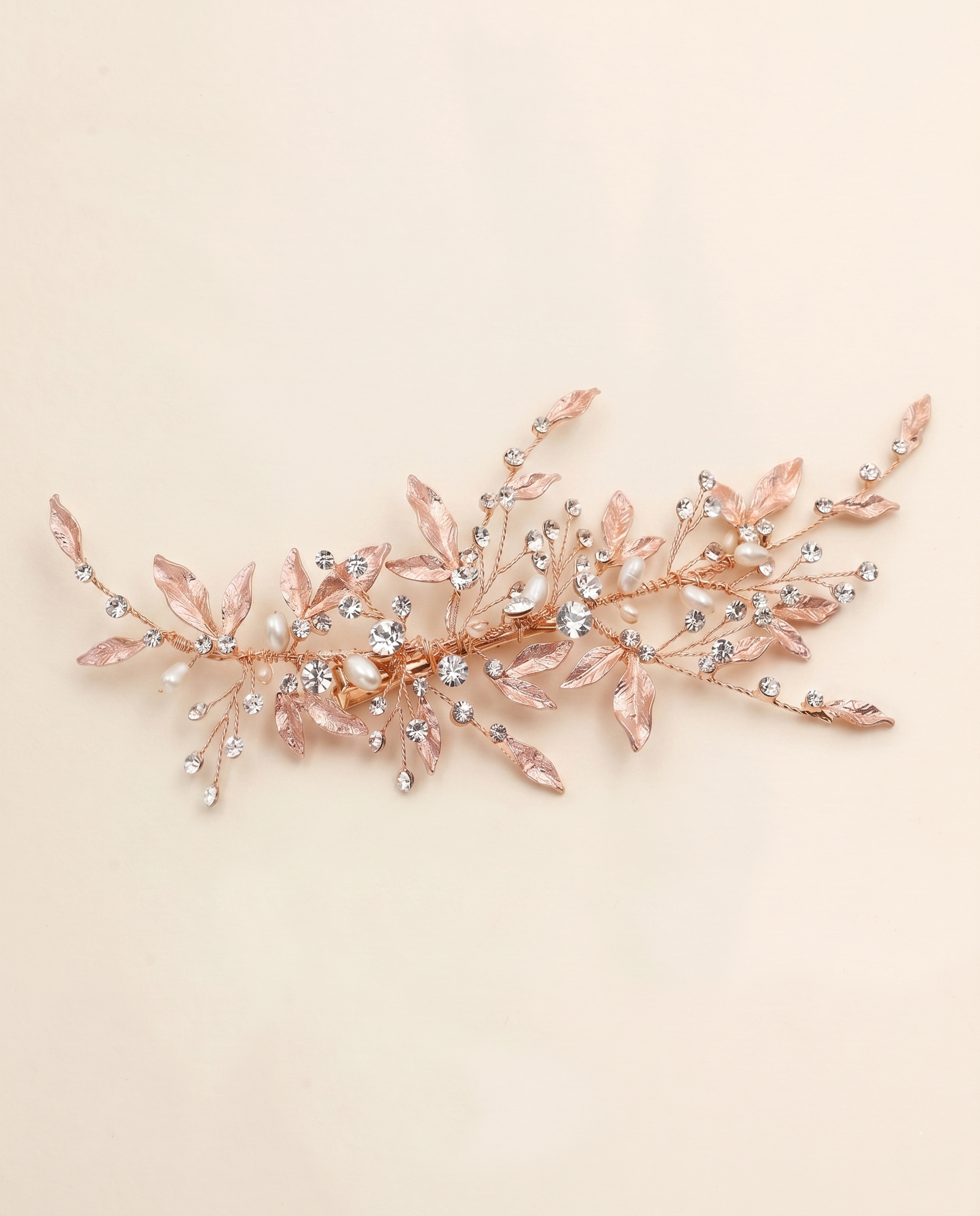 A decorative hair accessory with a floral design and sparkling crystal elements.