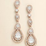 a pair of elegant gold earrings with numerous small diamonds set in a circular pattern. The earrings have a long, dangling design with multiple tiers of diamonds, creating a sophisticated and eye-catching piece of jewelry.