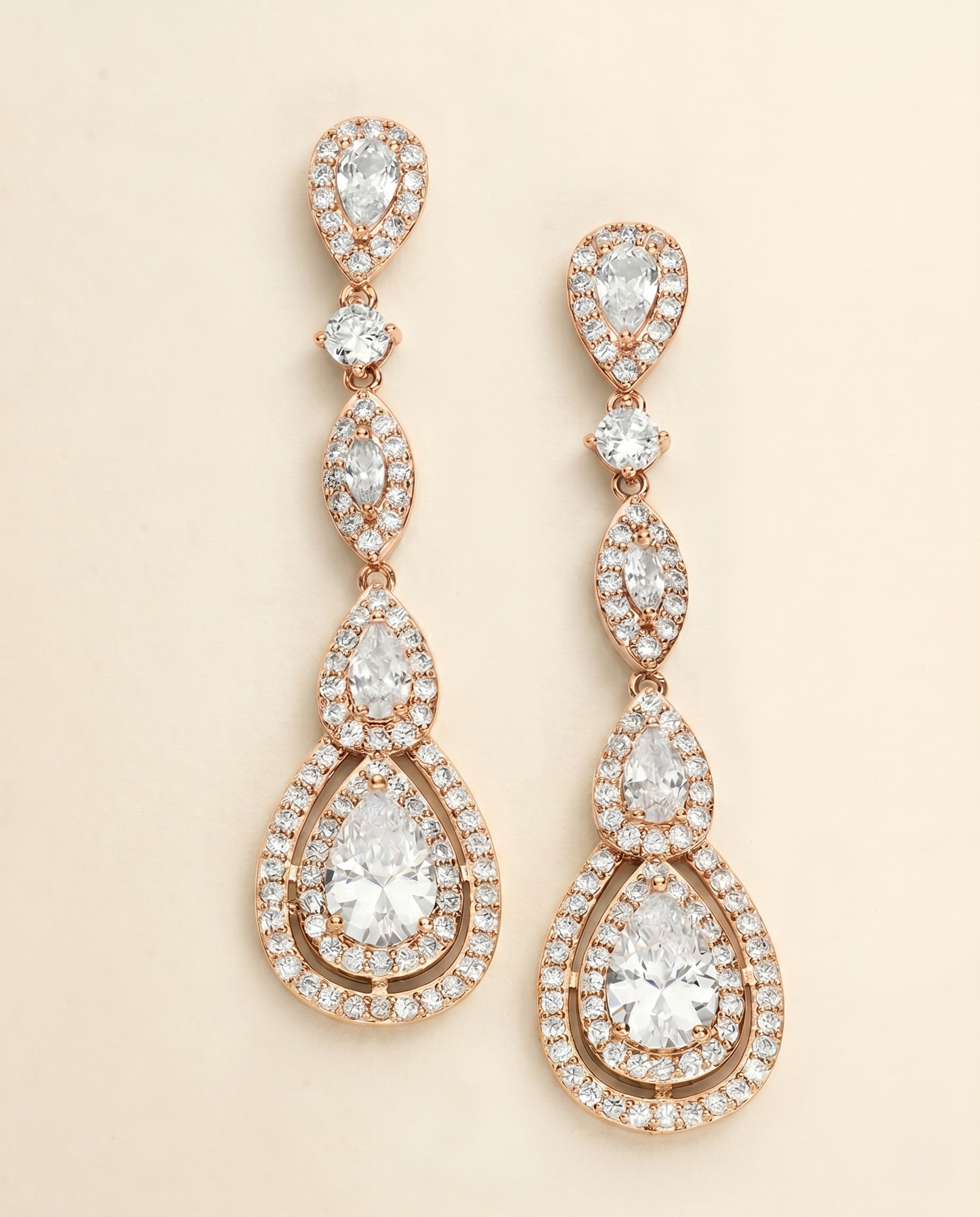 a pair of elegant gold earrings with numerous small diamonds set in a circular pattern. The earrings have a long, dangling design with multiple tiers of diamonds, creating a sophisticated and eye-catching piece of jewelry.