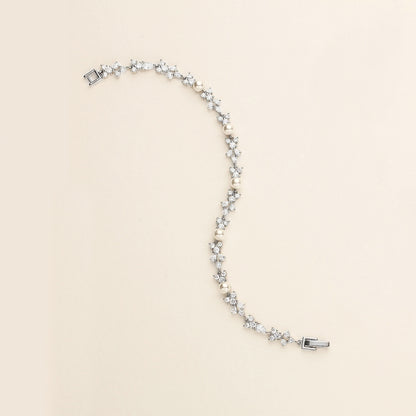 a white pearl necklace with a silver clasp