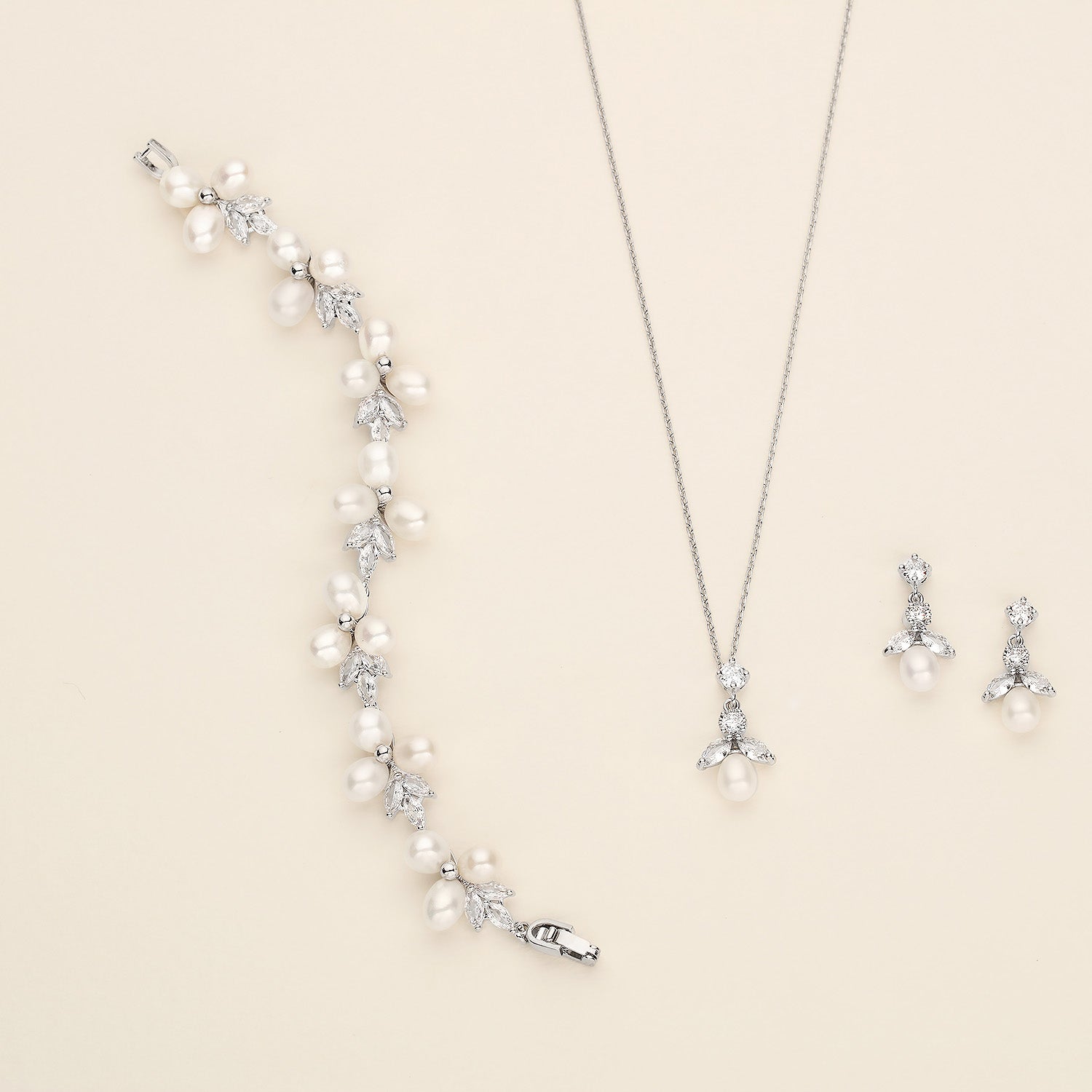 a necklace and earring set with pearls