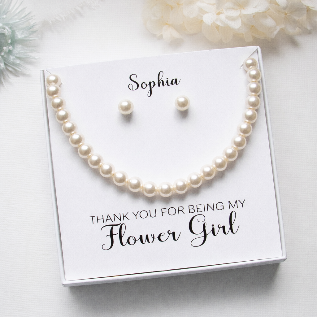 a necklace and earrings set presented in a white box with a personalized message.