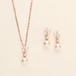 a necklace and earring set with pearls
