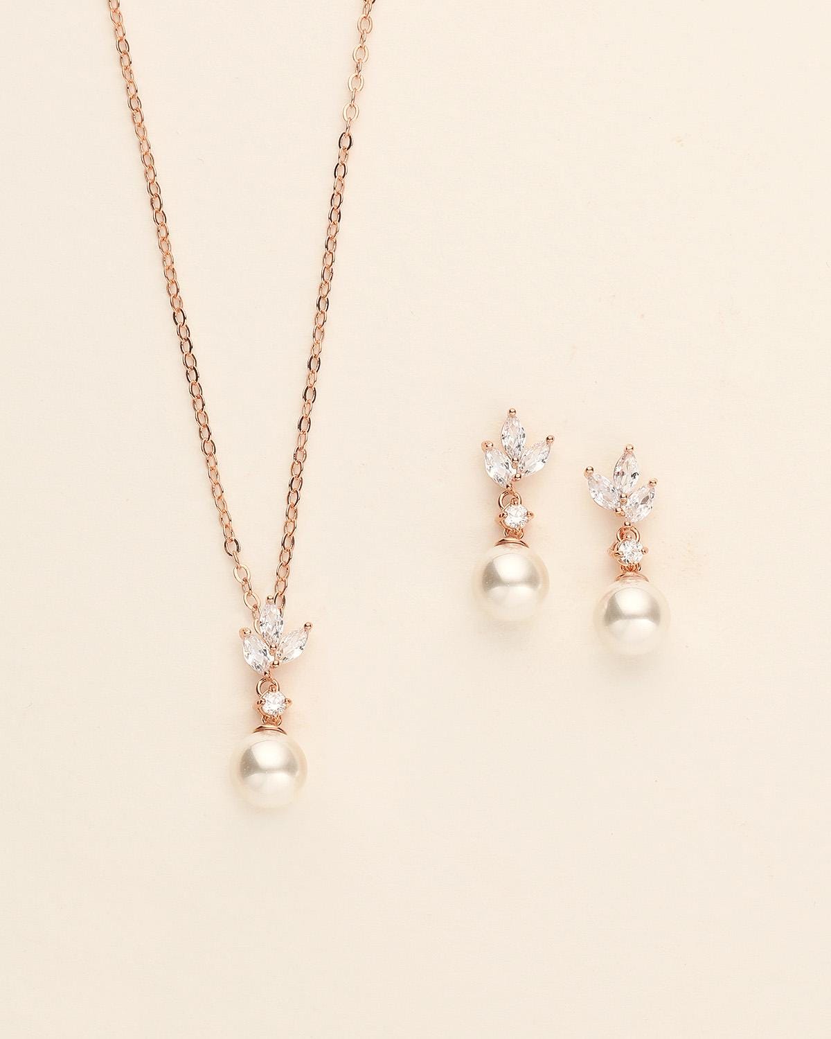 a necklace and earring set with pearls