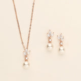 a necklace and earring set with pearls