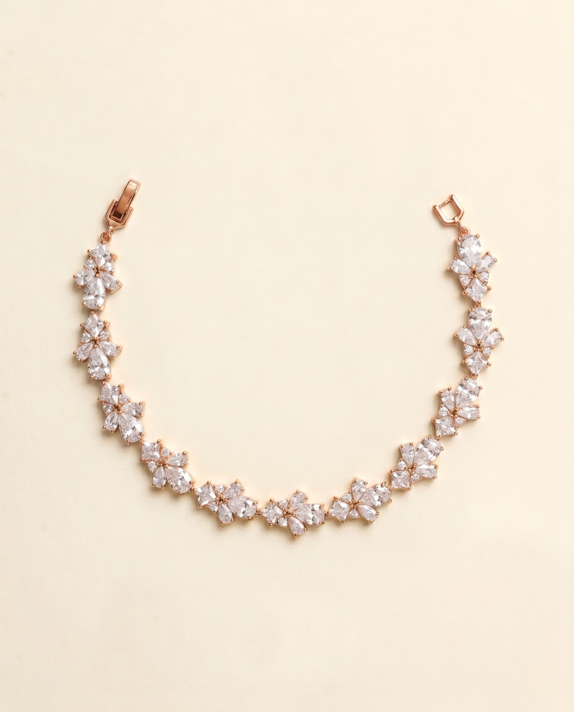 A delicate necklace with a row of small, clear gemstones arranged in a floral pattern.