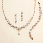 A necklace and a bracelet are displayed on a light-colored background.