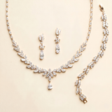 A necklace and a bracelet are displayed on a light-colored background.