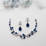 a necklace and earring set with blue stones