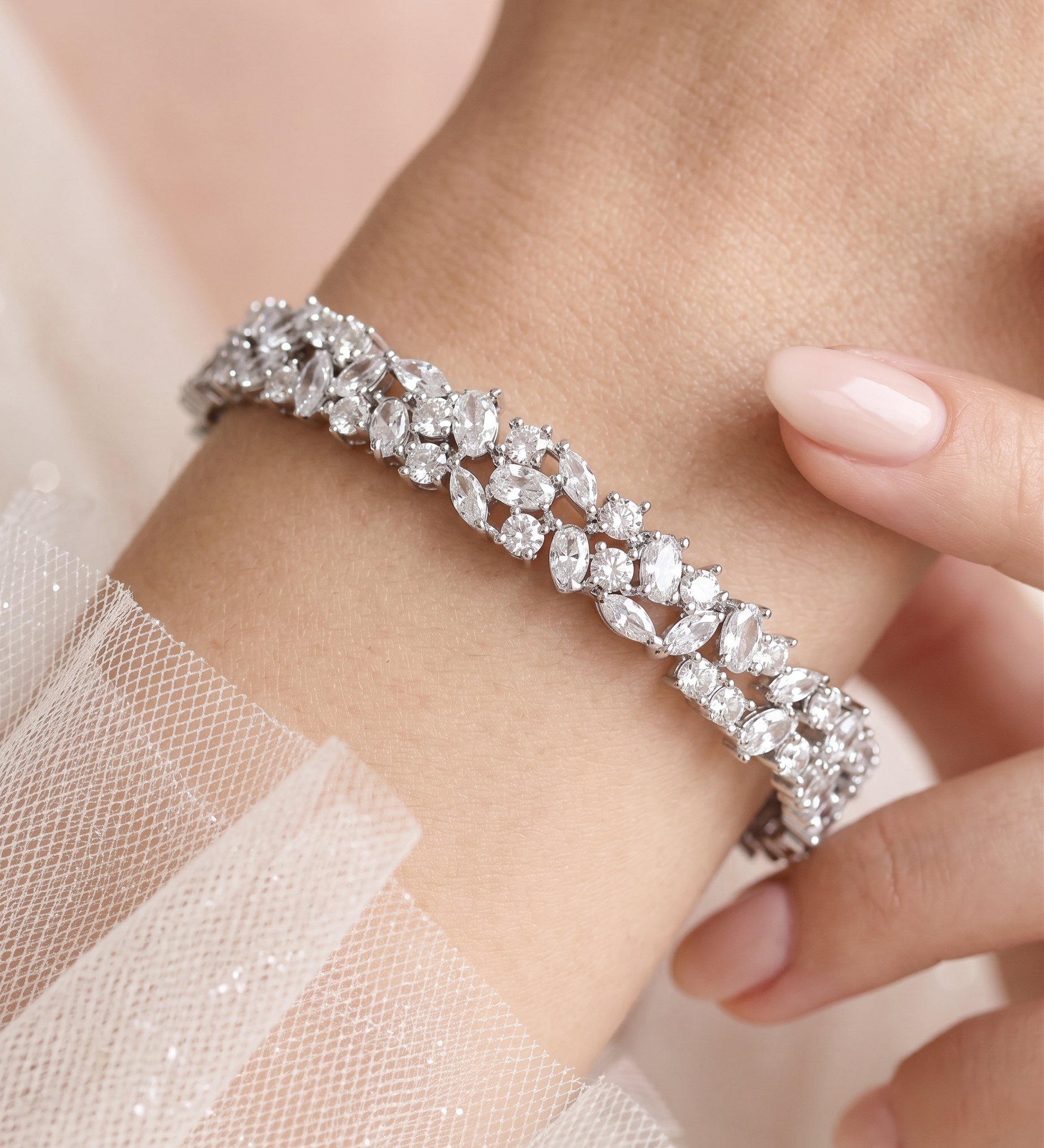 A close-up of a person's wrist wearing a diamond bracelet.