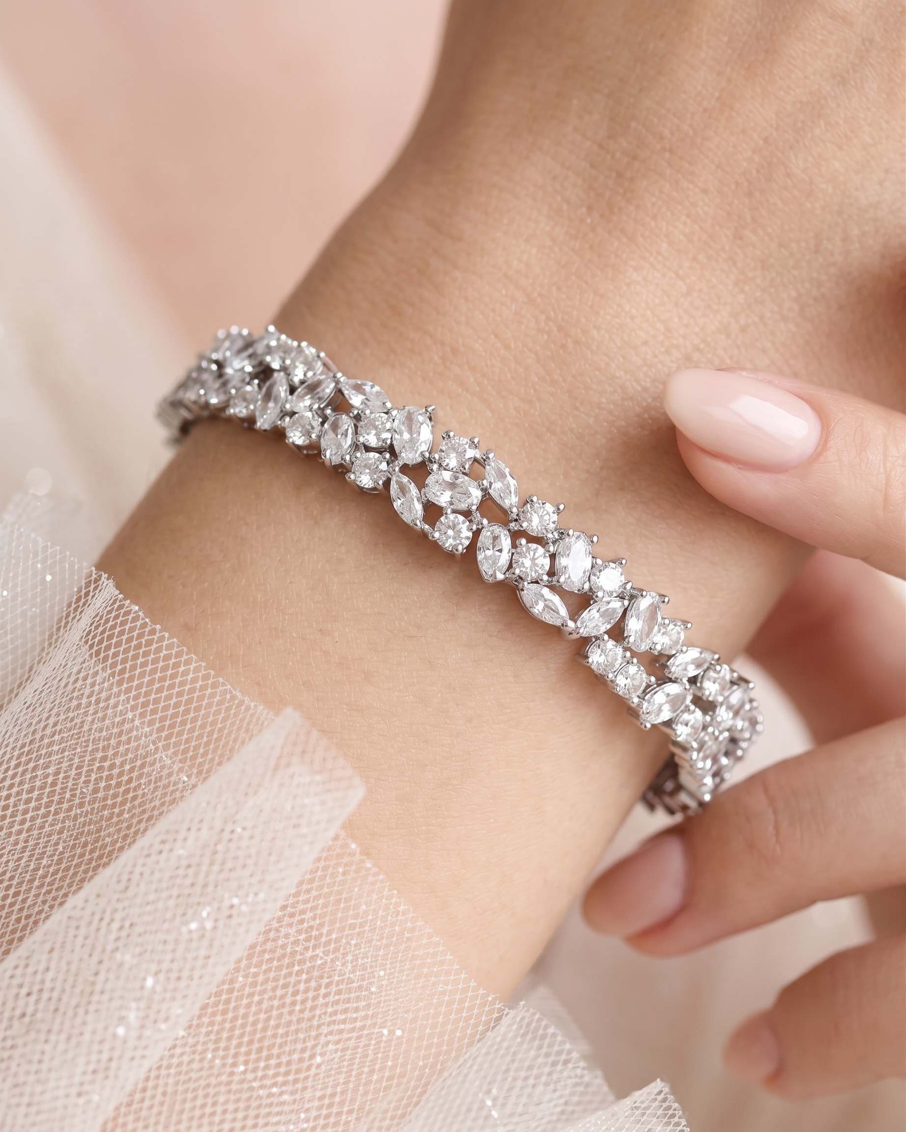 A close-up of a person's wrist wearing a diamond bracelet.