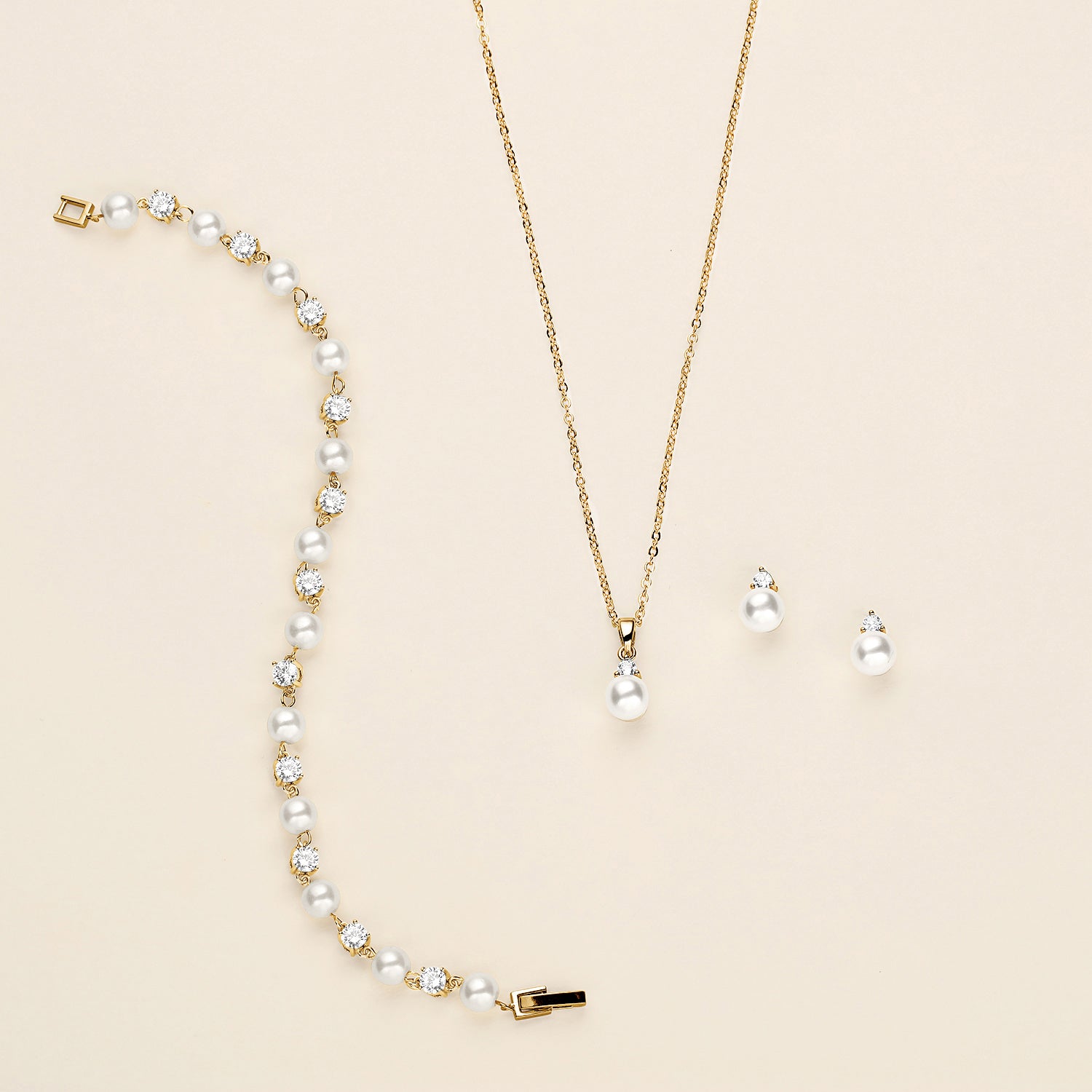 a necklace and earring set with pearls