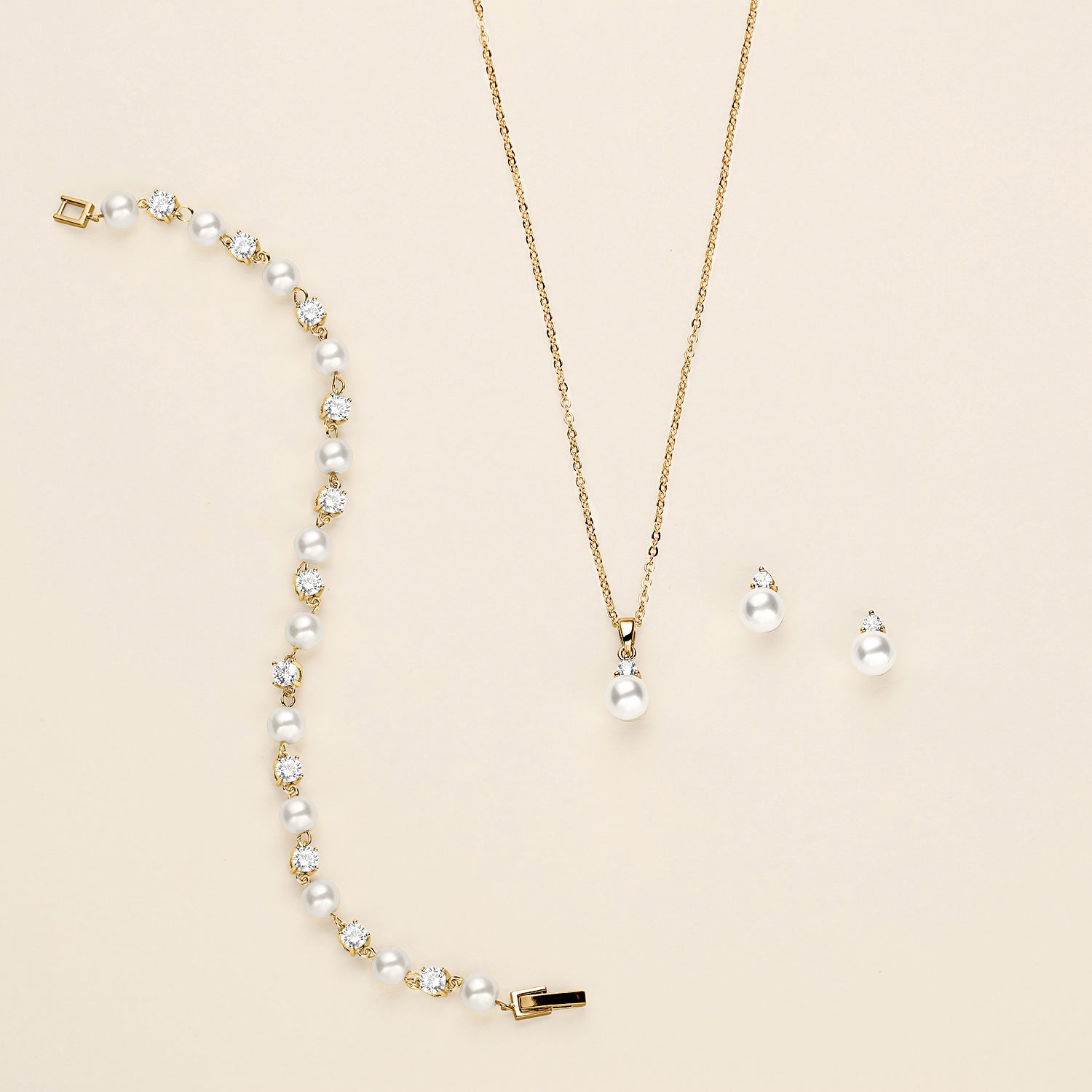 a necklace and earring set with pearls