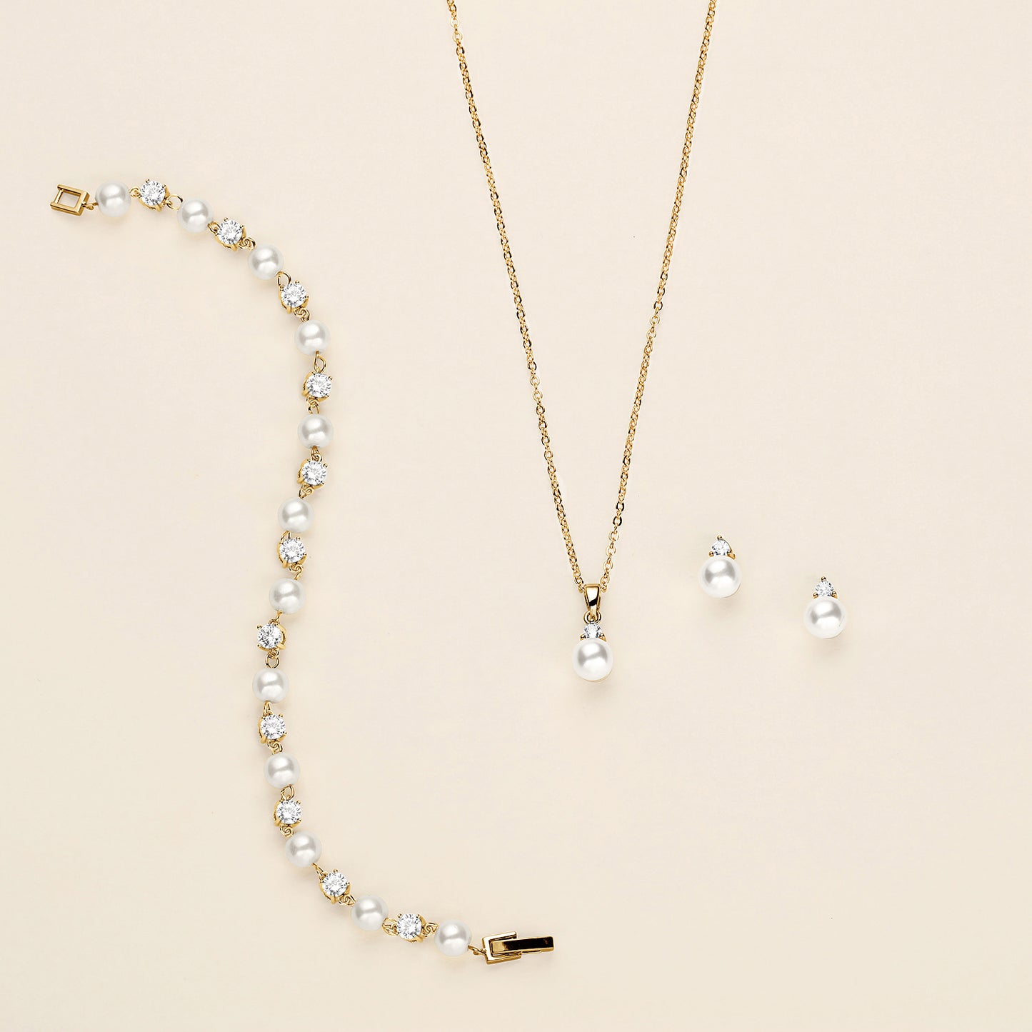 a necklace and earring set with pearls