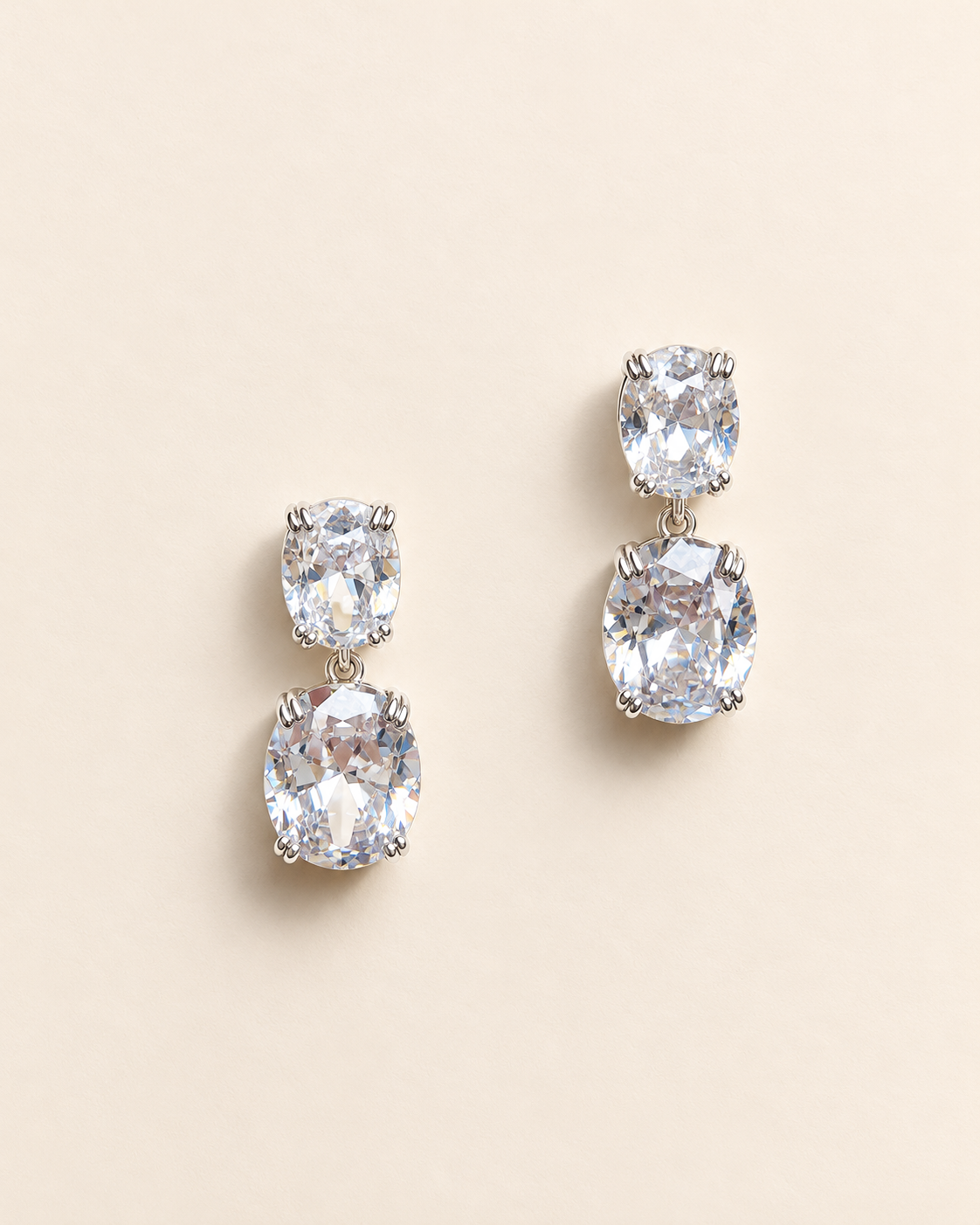 Josephine silver-finish drop earrings with clear faceted cushion-shaped accents and double-prong detail