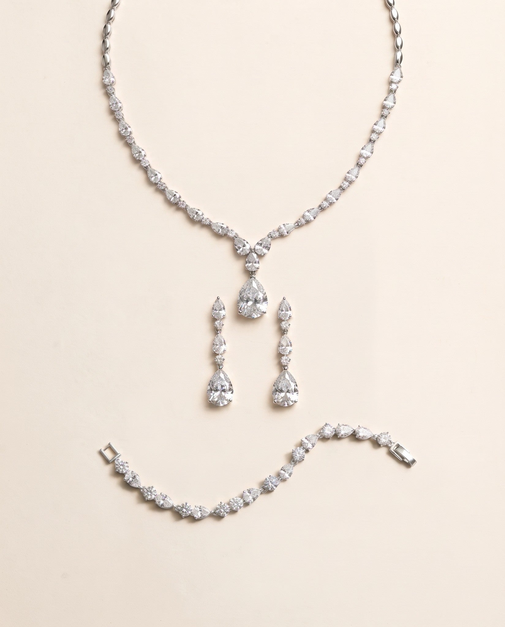 Kasey silver necklace, matching drop earrings and round-and-pear bracelet three-piece set