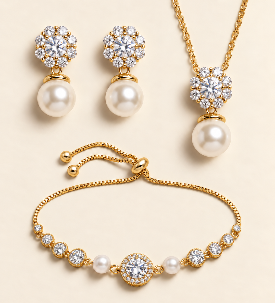 Livia gold three-piece pearl and cubic zirconia jewelry set with earrings, necklace, and slider bracelet.