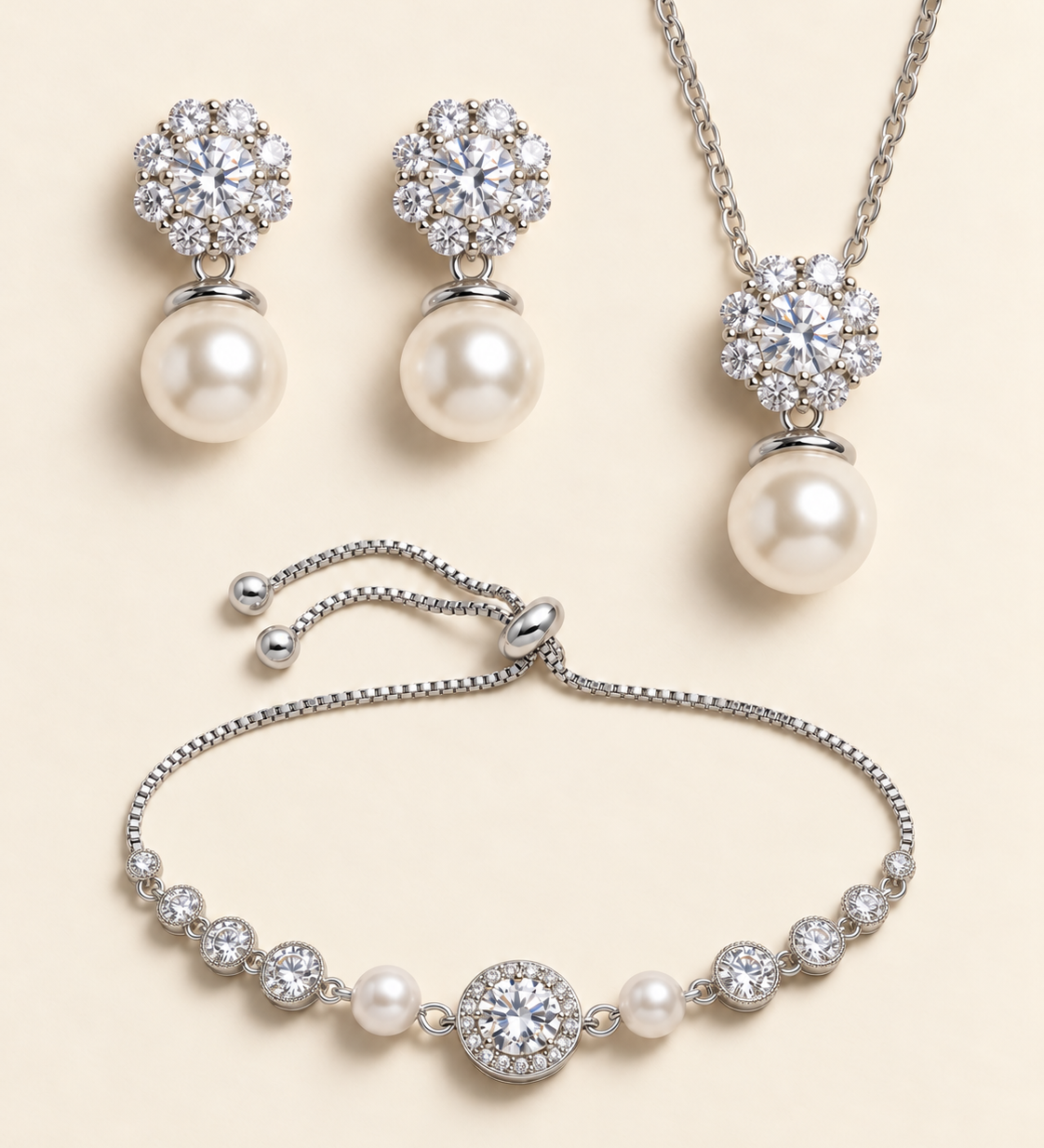 Livia silver three-piece pearl and cubic zirconia jewelry set with earrings, necklace, and slider bracelet.