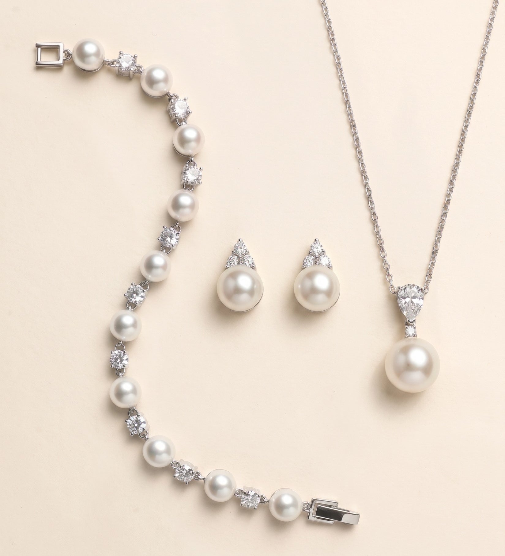 Madelyn silver pearl earrings, pear crystal pearl pendant necklace and pearl crystal bracelet three-piece jewelry set