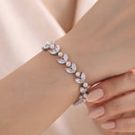 Miranda silver-finish leaf bracelet worn on a wrist, showing clear marquise-shaped accents and round pearl-like details