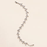 Full-length Vivienne silver-finish leaf bracelet on a cream background, showing the lobster clasp and extension chain