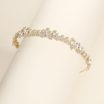 a close up of a bracelet on a white surface