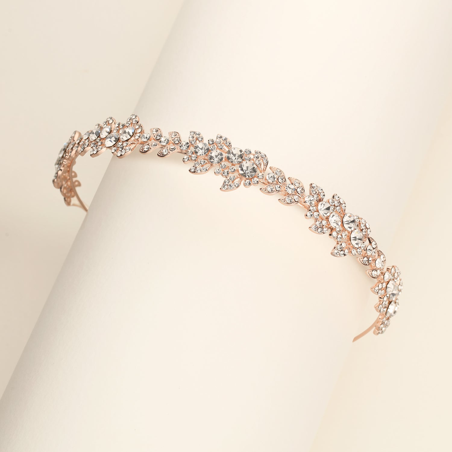 a close up of a bracelet on a white surface