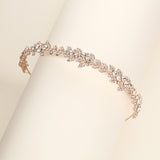 a close up of a bracelet on a white surface