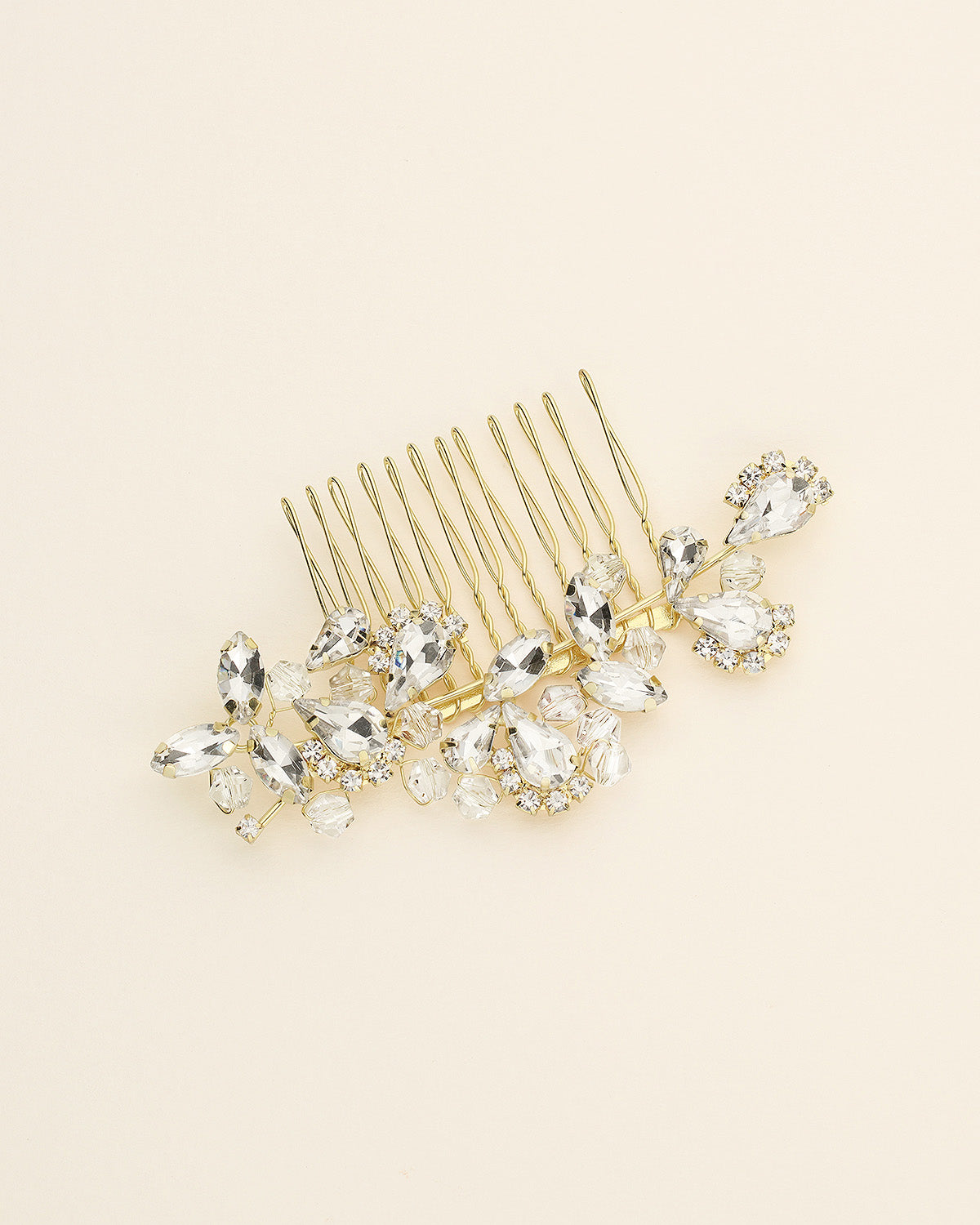 a hair comb with a bunch of crystals on it