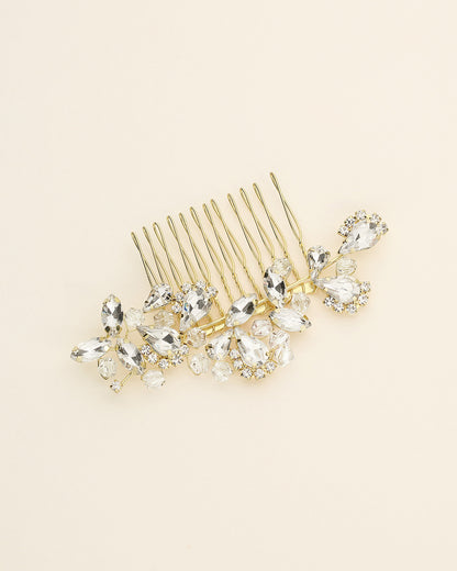 a hair comb with a bunch of crystals on it