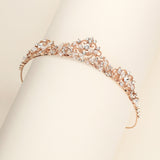 a close up of a bracelet on a white surface