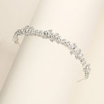 a close up of a bracelet on a white surface