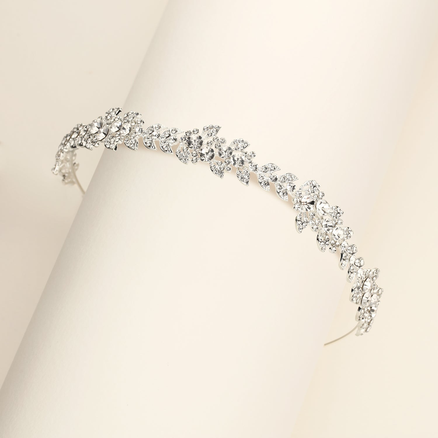 a close up of a bracelet on a white surface