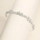 a close up of a bracelet on a white surface