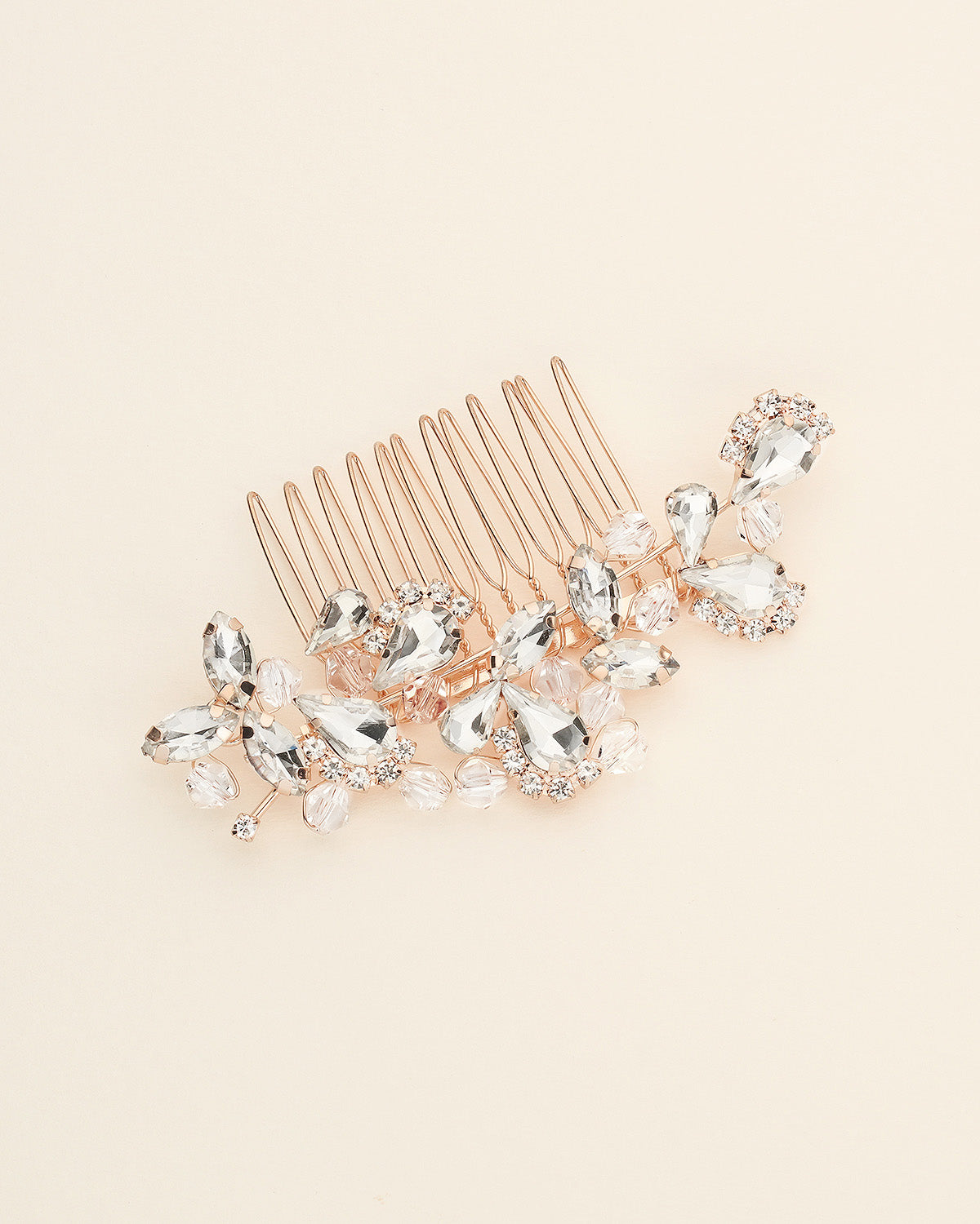 a hair comb with a bunch of crystal stones on it